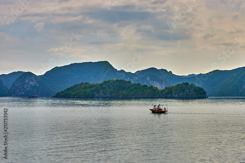 Halong bay boats, Vietnam Panoramic view of sunset in Halong Bay, Vietnam, Southeast Asia,UNESCO World Heritage Site