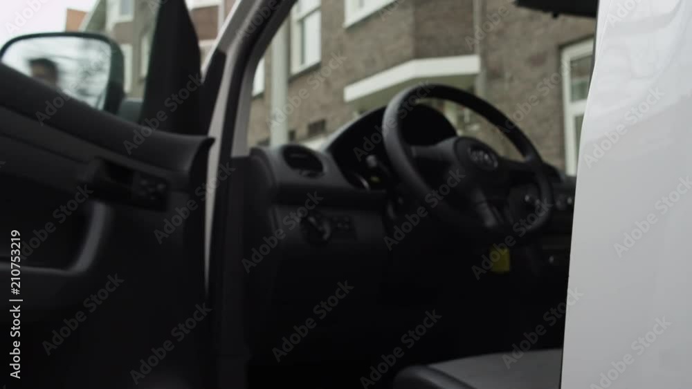 Close up, person leaves parked car Close up, person leaves parked car