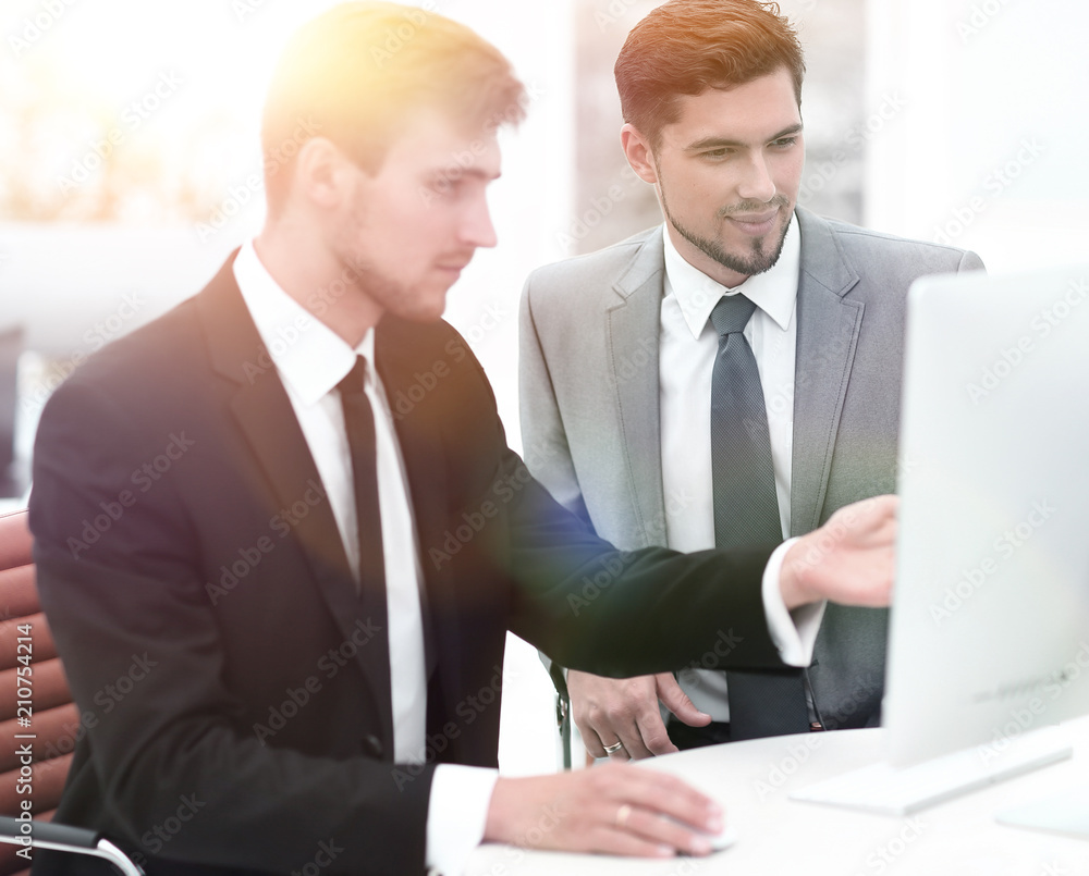 employees are talking sitting behind a Desk employees are talking sitting behind a Desk