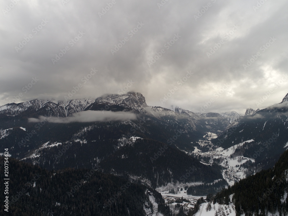 drone flying top view of  alps on bad weather  winter day