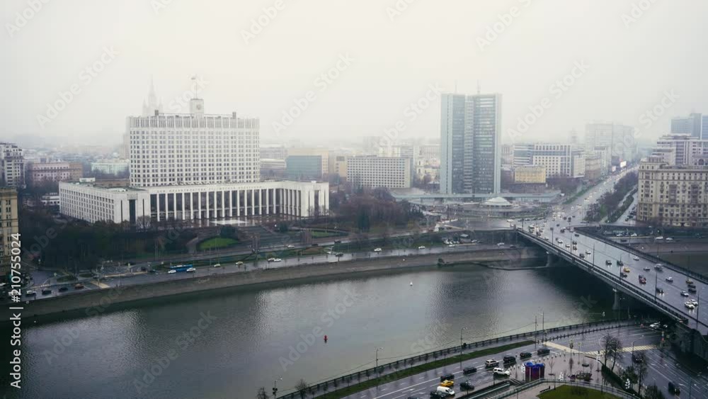 The House of the Government of the Russian Federation. Cars and skyscrapers. Foggy day Moscow. Locked down real time medium shot The House of the Government of the Russian Federation. Cars and skyscrapers. Foggy day Moscow. Locked down real time medium shot