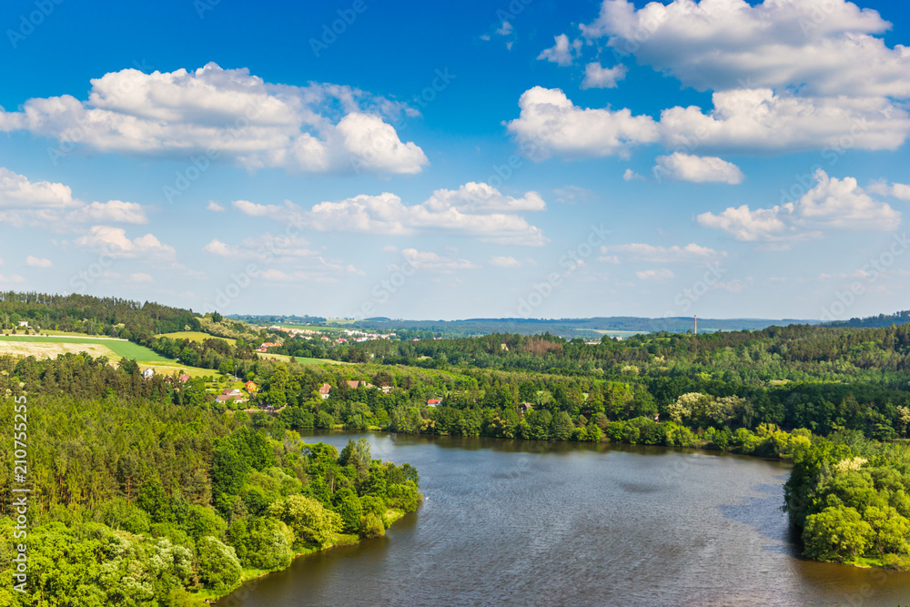Vltava river in deciduous forest, aerial view, summer day.
