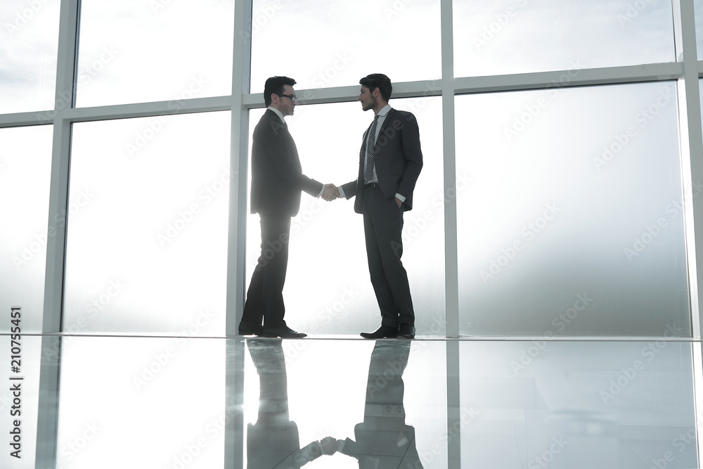 business background.handshake business partners .