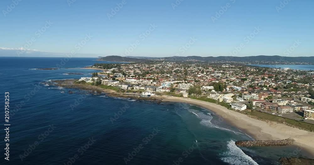 From open sea of Pacific ocean hovering along endless waterfront of Central coast around The Entrance town – where Tuggerah lake enters the ocean.
