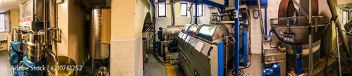 Machines for processing olive paste in a modern Italian oil mill. photo