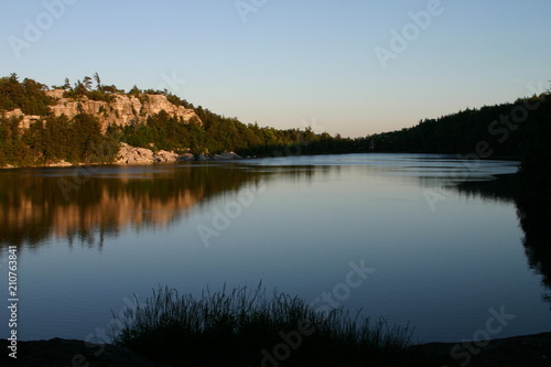 Evening lake with hills reflection