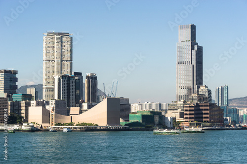 Kowloon skyline at Tsim Sha Tsui view from across the Victoria harbour in Hong Kong on a sunny day in China SAR.