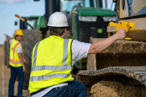 climbing on excavator equipment
