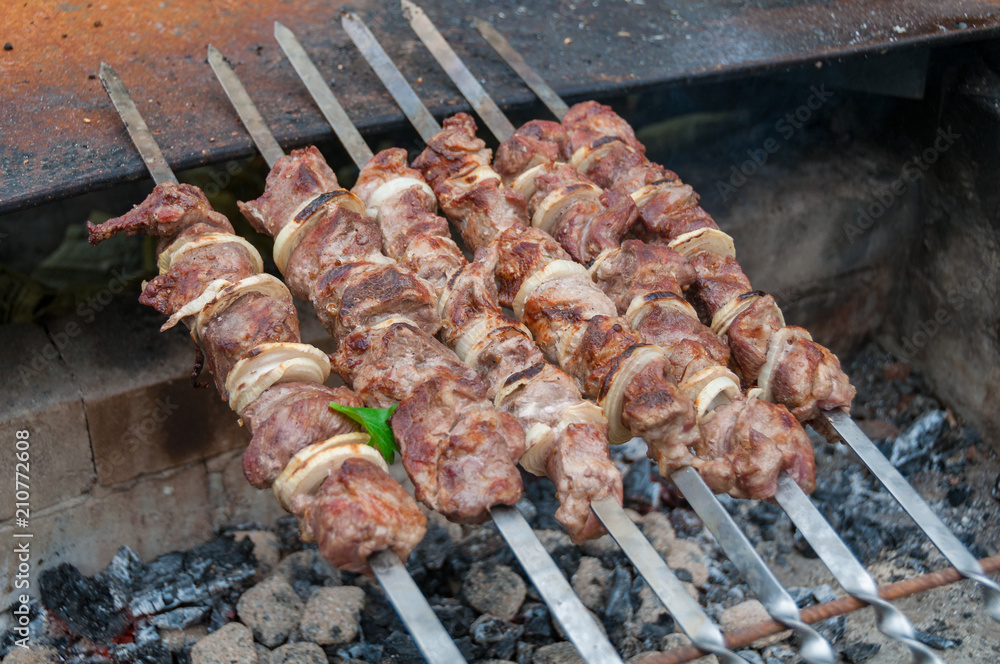 Meat on a stick over charcoal, barbecue, shashlik, kebab cooking