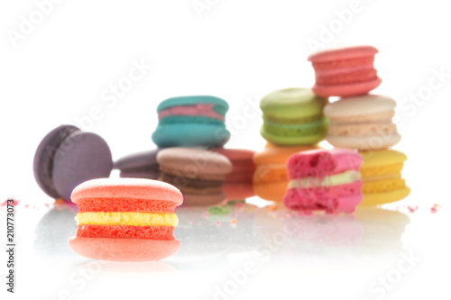 Colorful french macarons on white background.