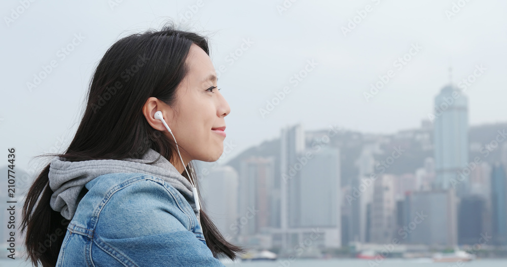 Fototapeta premium Woman listen to music on cellphone