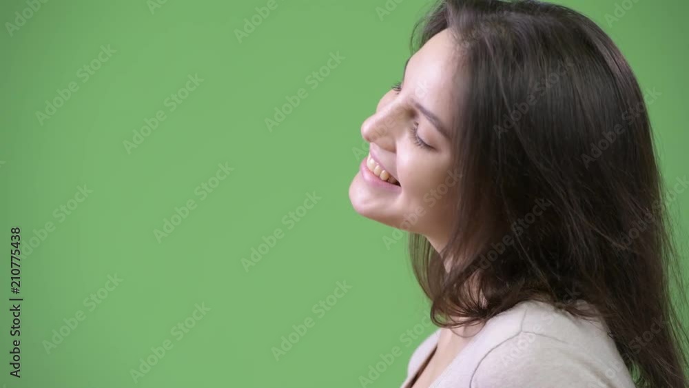 Profile view of young happy beautiful woman relaxing with eyes closed Profile view of young happy beautiful woman relaxing with eyes closed