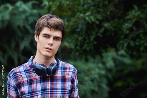 Guy in the forest is listening to music