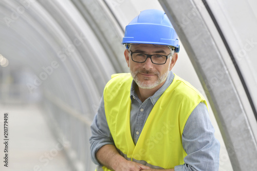 Portrait of industrial engineer with security hat and lifevest