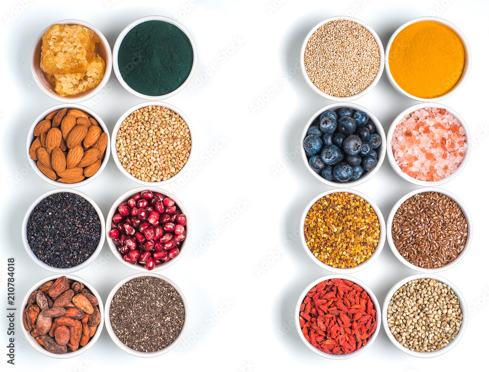 Various superfoods in bowl oisolated on white Various superfoods in bowl oisolated on white