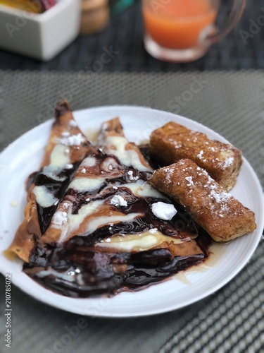 Crepes with Chocolate Sauce and Powdered Sugar