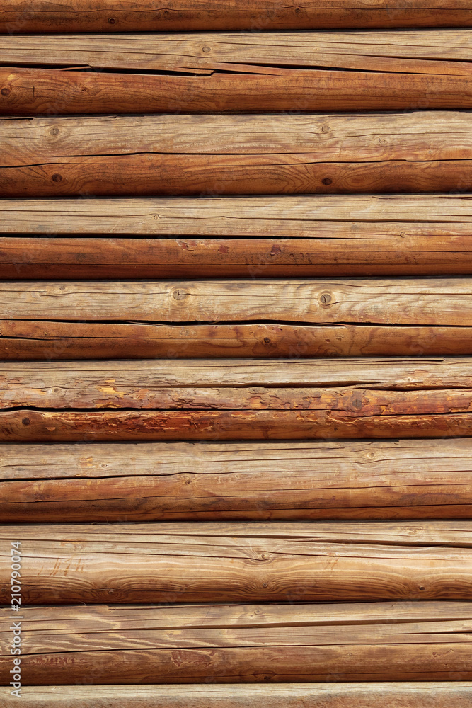 Logs on the wall with a log frame as a background Logs on the wall with a log frame as a background