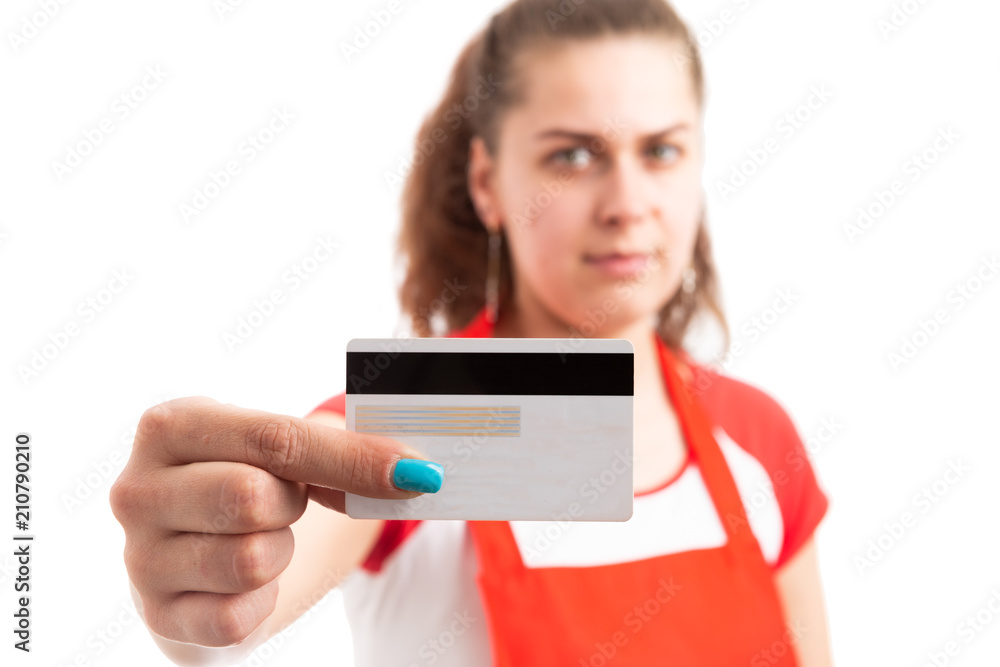 Female supermarket or hypermarket employee holding credit card.