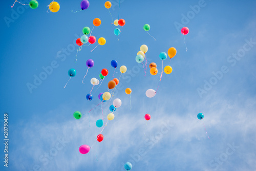 Colorful balloons on a blue sky background