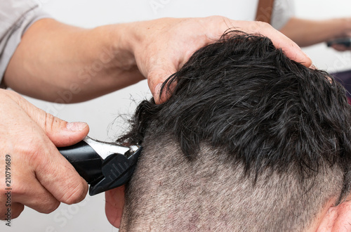 men's haircut with a typewriter