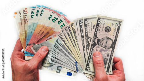 Hands with money isolated on a white background. EU Euro and US Dollar