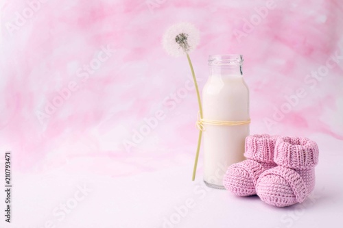 Bilde på lerret Its a girl pink theme baby shower or sip and see party background with decorative elements - booties and milk bottle
