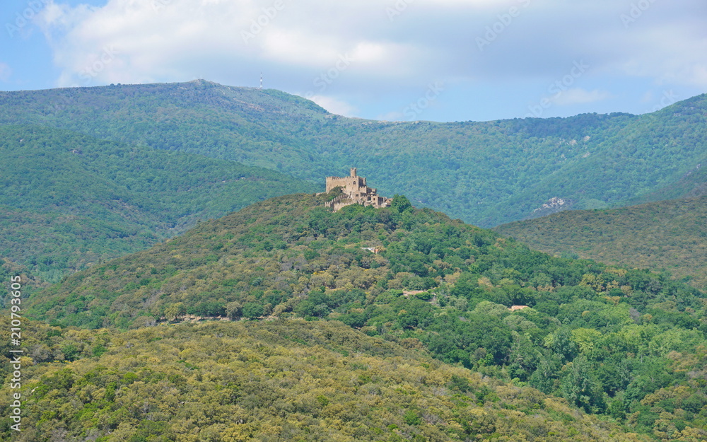 The castle of Requesens on the top of the hill with the peak Neulos in background, Albera massif, la Jonquera, Alt Emporda, Girona, Catalonia, Spain