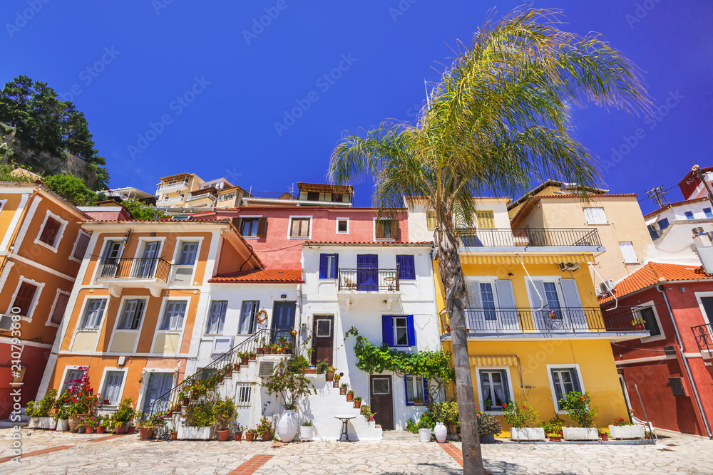 Fototapeta premium Traditional greek street with flowers in Parga, Greece
