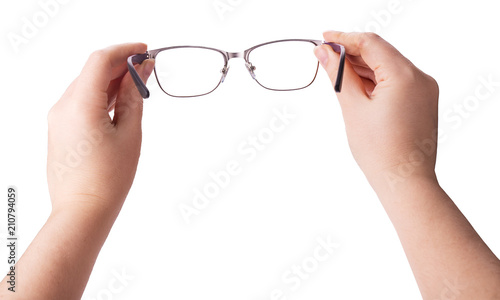 Female hands holding a pair of glasses