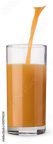 in a glass beaker pour fresh peanch juice photo