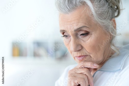 Close up portrait of tired senior woman