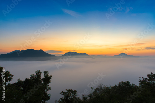 mountains under mist in the morning with sunrise at Phutoke Loei Thailand