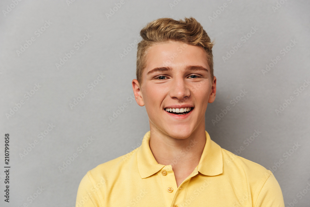 Close up portrait of a cheerful teenage boy - obrazy, fototapety, plakaty 