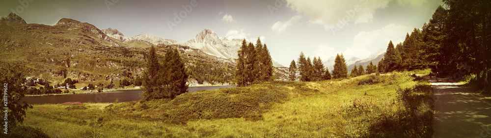 Panoramic view of the landscape around Sils Lake in the upper Engadine Valley (Switzerland - Europe) - Toned with a retro vintage instagram filter effect Panoramic view of the landscape around Sils Lake in the upper Engadine Valley (Switzerland - Europe) - Toned with a retro vintage instagram filter effect