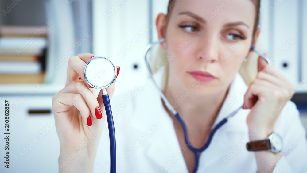 Close-up of female doctor hand holdong stethoscope , focus on stethoscope. Close-up of female doctor hand holdong stethoscope , focus on stethoscope.