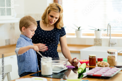 Mother and child preparing cookies