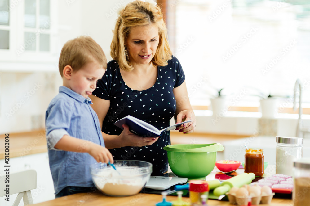 Happy mother and child in kitchen