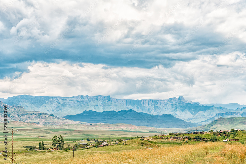 Township with the Amphitheatre in the Drakensberg in the back