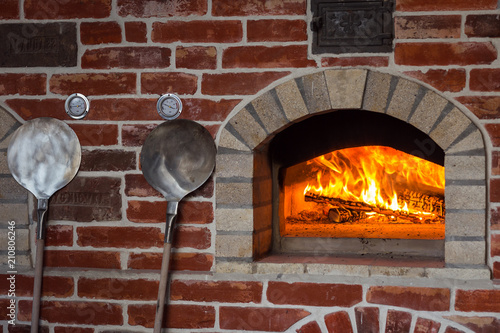 Traditional italian Pizza oven, burning wood and flames in fireplace