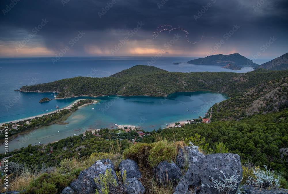 lightning on a stormy sky on the Mediterranean coast during sunset. Turkey