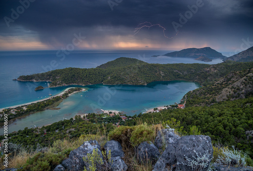 lightning on a stormy sky on the Mediterranean coast during sunset. Turkey