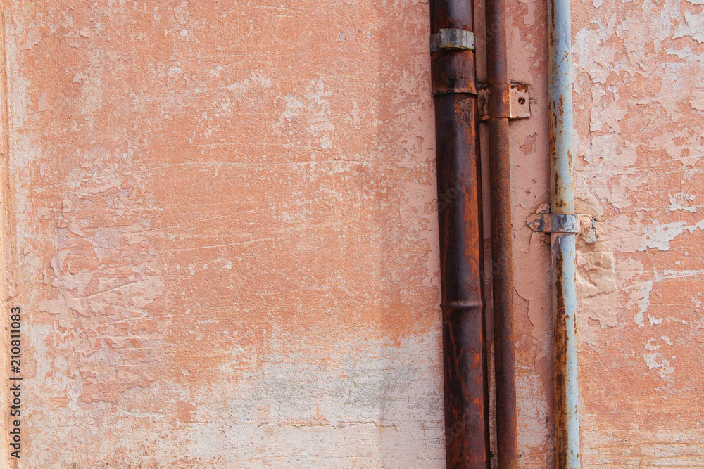 Pipes against the background of an orange wall Pipes against the background of an orange wall