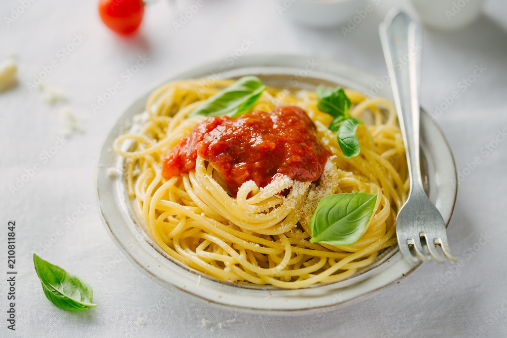 Pasta dish with tomato sauce on white plate Pasta dish with tomato sauce on white plate