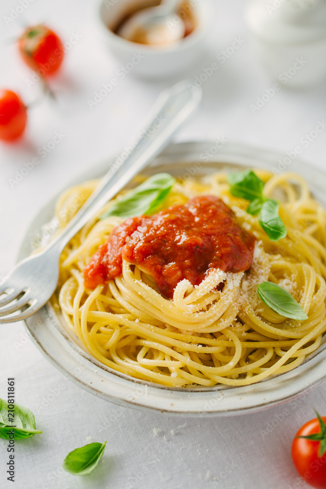 Pasta dish with tomato sauce on white plate Pasta dish with tomato sauce on white plate