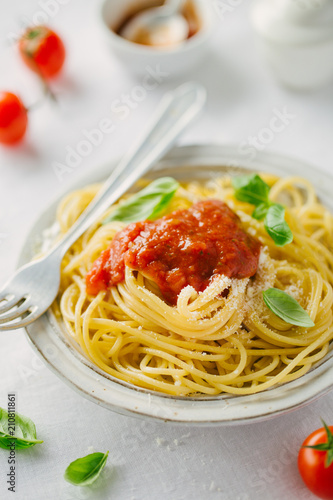 Pasta dish with tomato sauce on white plate