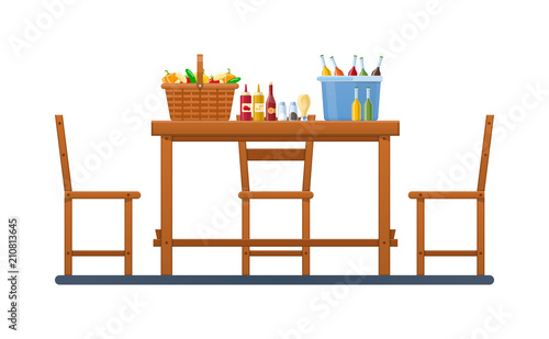 Set products and vegetables, in wicker basket. Wooden furniture.