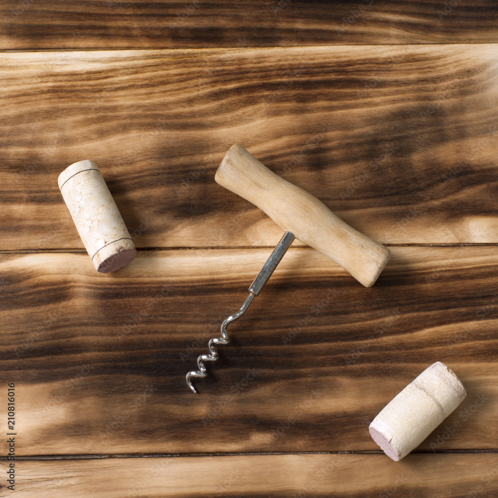wine corks and corkscrew on a wooden background, still life for restaurants