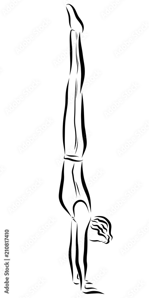 A young man in sports clothes is standing on his hands A young man in sports clothes is standing on his hands