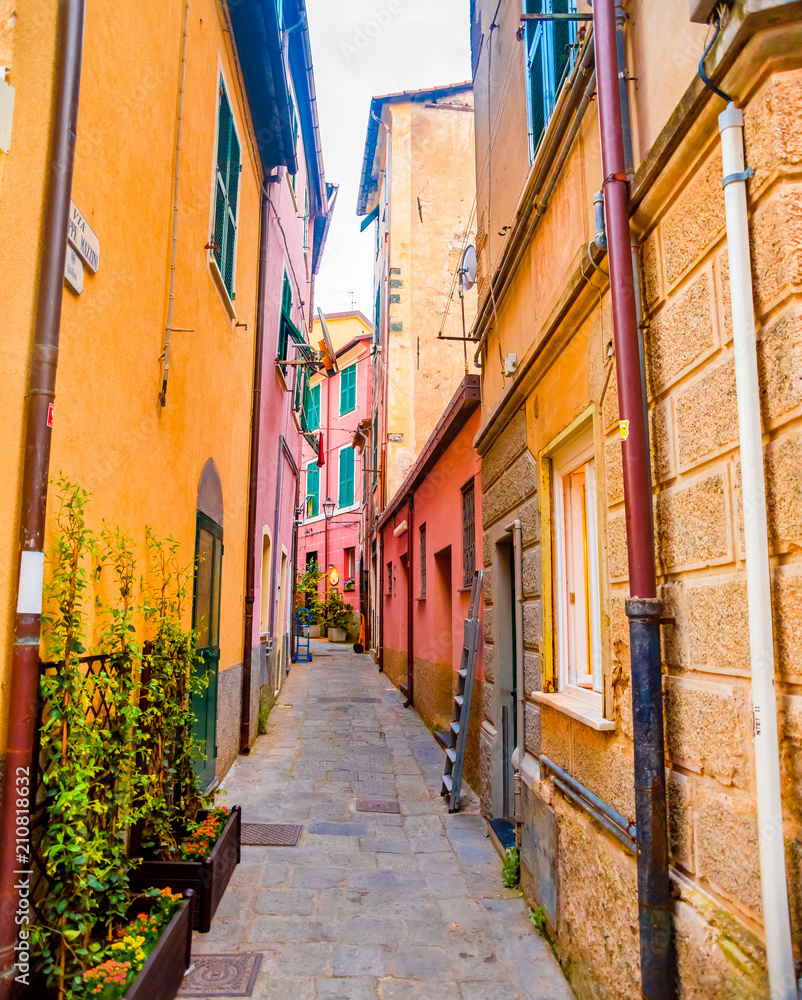 Fototapeta premium Colorful buildings in Monterosso in Cinque Terre, Italy on an overcast day.