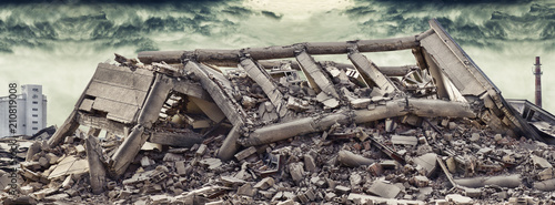 Photos Collapsed concrete industrial building with dramatic sky and factory chimney and another concrete building in background